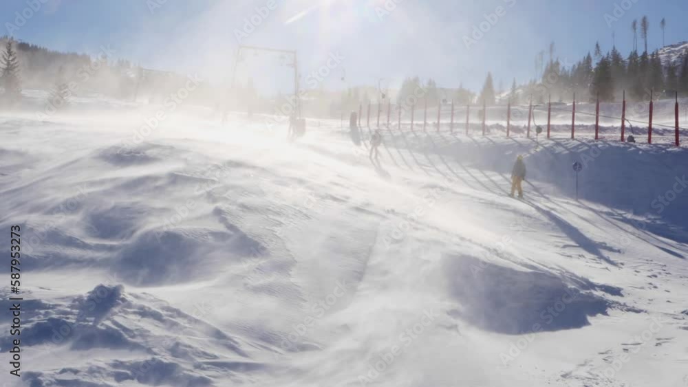 High Winds on Lifts near Ski Slopes and Snow lifted from the Ground - slow motion High Winds on Lifts near Ski Slopes and Snow lifted from the Ground - slow motion