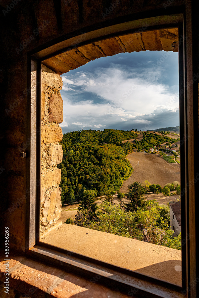 View through a window of the Montefeltro hills in the Marche region of central Italy