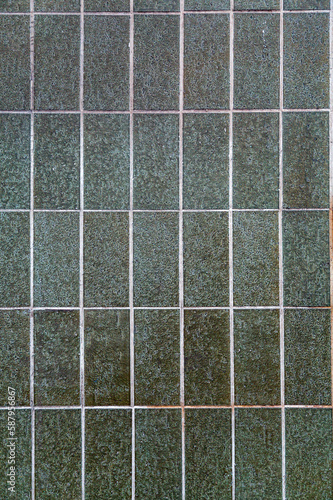 Fragment of glazed ceramic tiled wall