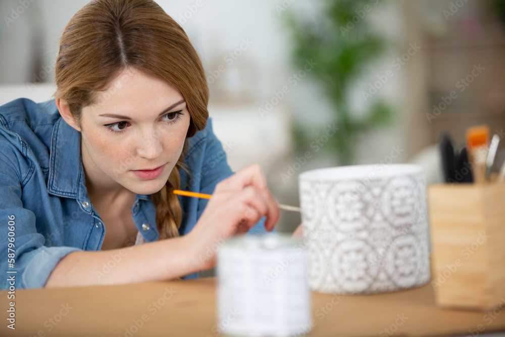 woman working in her pottery studio woman working in her pottery studio