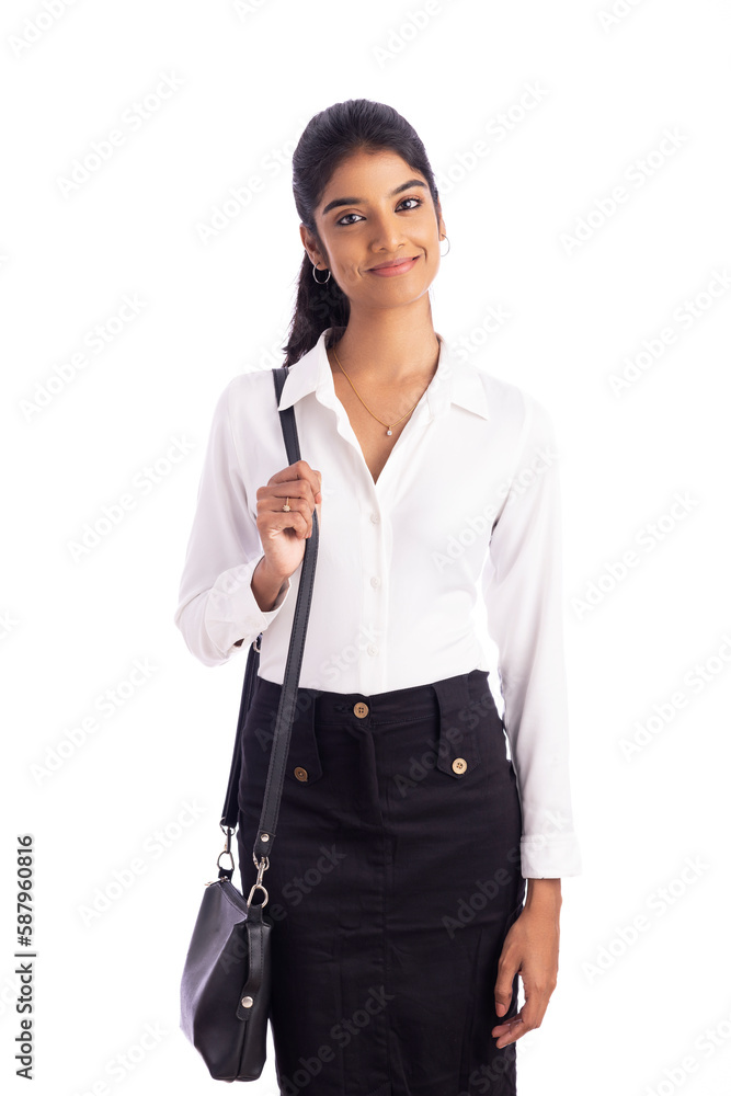 Indian young business woman posing with hand bag on white. Indian young business woman posing with hand bag on white.