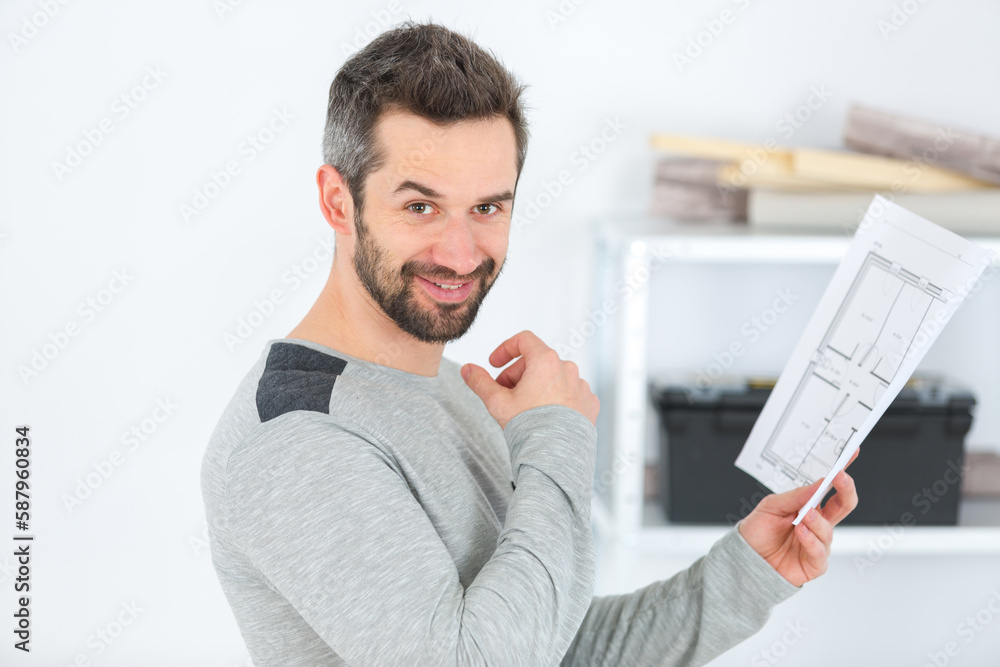 Fototapeta premium real-estate agent checking house plans