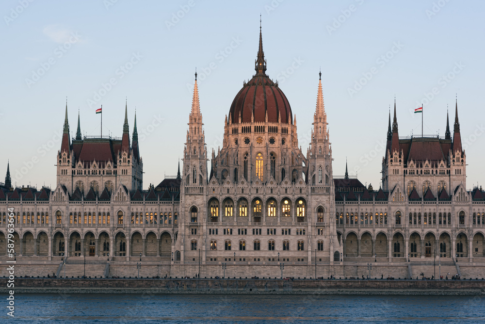 The last rays of sun illuminate the Hungarian Parliament building in Budapest