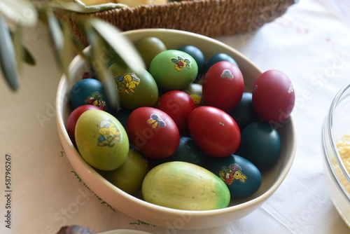 Close-up of Easter breakfast table with traditional slovenian dishes. Ham, colorful eggs, potica and horseraddish.