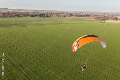 aerial view paraglider over the fields