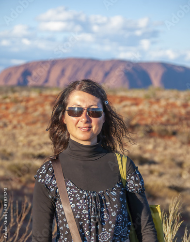 Portrait of a happy caucasian woman relaxing during a hike in the australian outback