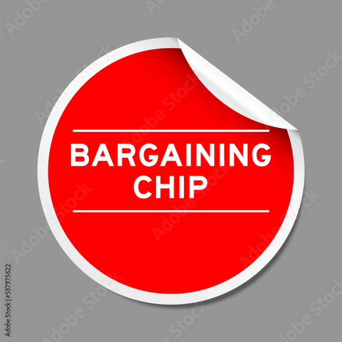 Red color peel sticker label with word bargaining chip on gray background