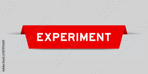 Red color inserted label with word experiment on gray background