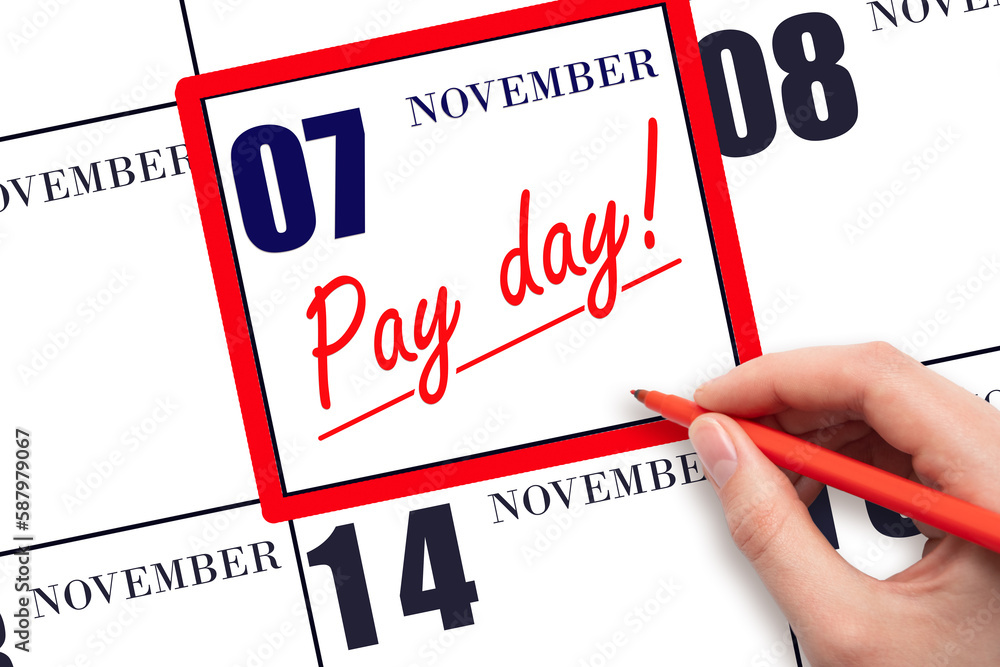 Hand writing text PAY DATE on calendar date November 7 and underline it. Payment due date Hand writing text PAY DATE on calendar date November 7 and underline it. Payment due date