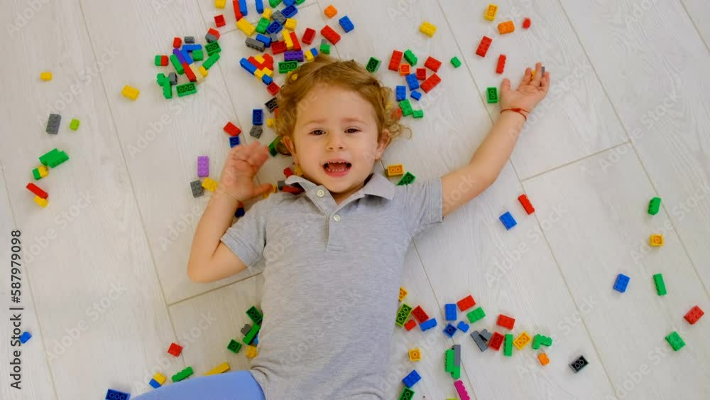 Constructor child plays in the room. Selective focus. Constructor child plays in the room. Selective focus.