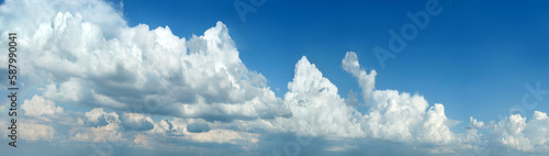 beautiful cumulus clouds on the background of the blue sky, panoramic view, i...