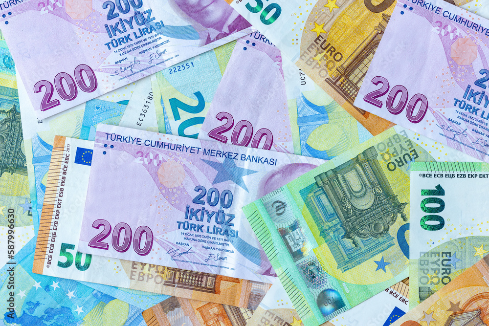 Group of money EURO and Turkish Lira banknote arranged in a chaotic manner. EURO and Turkish banknote isolated on pink background. Exchange money, Cash, Travel concept, Money background ,Currency. Group of money EURO and Turkish Lira banknote arranged in a chaotic manner. EURO and Turkish banknote isolated on pink background. Exchange money, Cash, Travel concept, Money background ,Currency.