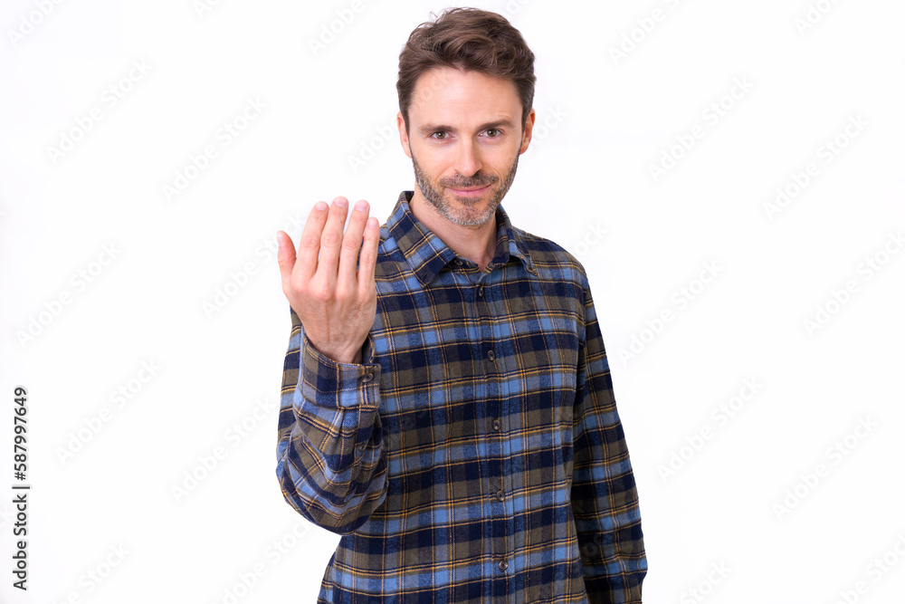 Adult hipster male model posing inviting someone to come over. Adult hipster male model posing inviting someone to come over.