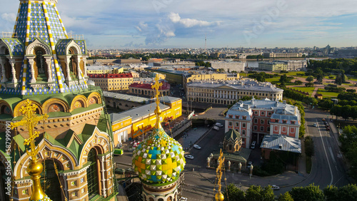 Aerial view of the Savior on Spilled Blood next to the park in the historical and at same time modern city of St. Petersburg at sunny summer sunrise, yellow