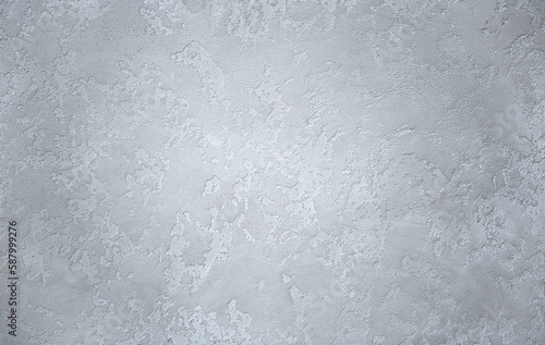 Light background of decorative plaster with abstract spots. Unusual texture of white or gray wall with beautiful patterns  creative surface background. Finishing coating for building cladding.