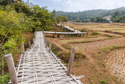 Pai Buddha bamboo bridge or Boon Ko Ku So stretches 800 meter long split-bamboo walkway across rice fields and up to a small temple.