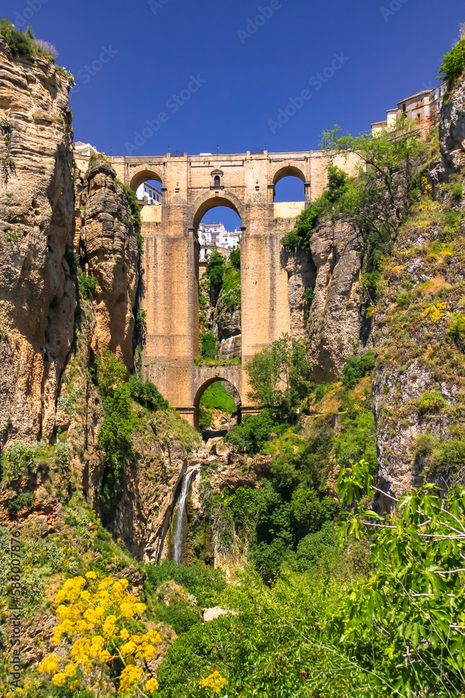 The picturesque landscape at the Puente Nuevo bridge in the Andalusian town of Ronda, Spain The picturesque landscape at the Puente Nuevo bridge in the Andalusian town of Ronda, Spain