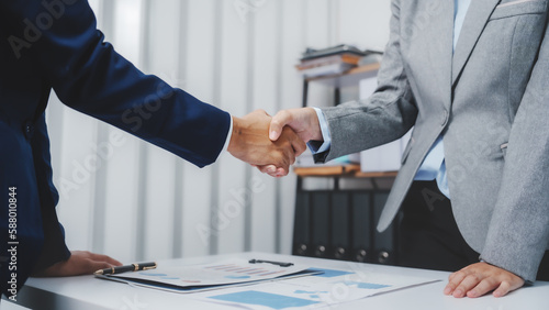 Shaking hands, Young Asia female leader business woman coaching new smes bookkeeping audit accounting interview with trainer training business job.