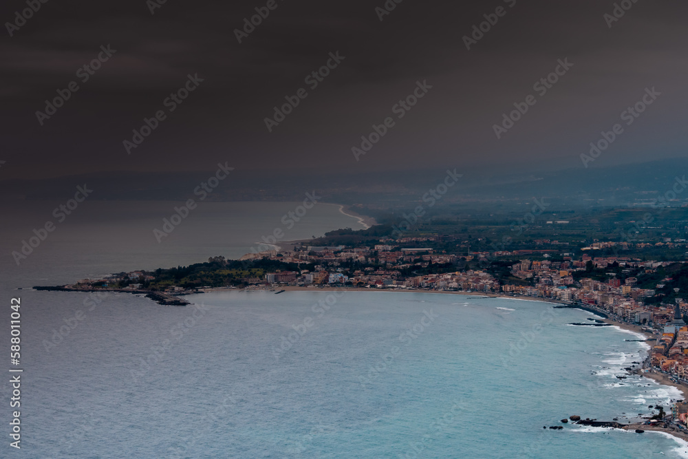 Summer in Taormina, Sicily. Panoramic view from above. Where the sea meets the city