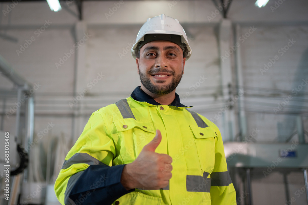 Portrait of male carpenter standing with arms crossed in the wood factory Portrait of male carpenter standing with arms crossed in the wood factory