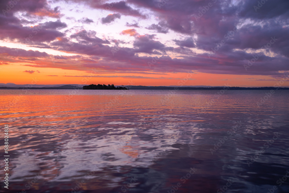 Cloudy sunset water reflection Cloudy sunset water reflection
