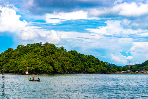 Travel Thailand by ferry boat yacht waves through tropical landscape. © arkadijschell
