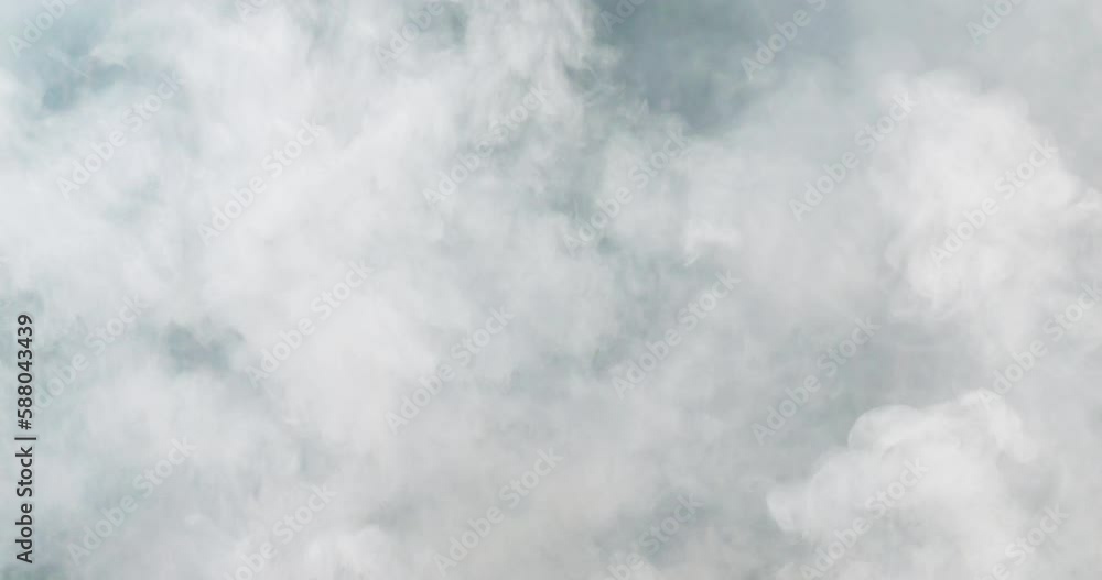 Close-up shot of white smoke rising into the air. Close-up shot of white smoke rising into the air.