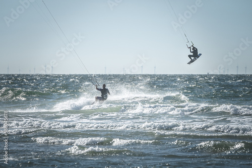 Kite surfers water sport event at neach in Zeeland