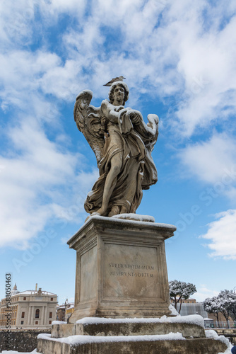 Angel Carrying the Garment and Dice Sculpted by Paolo Naldini, the statue represents the moment when Roman soldiers cast dice to determine who would receive Christ's seamless robe.