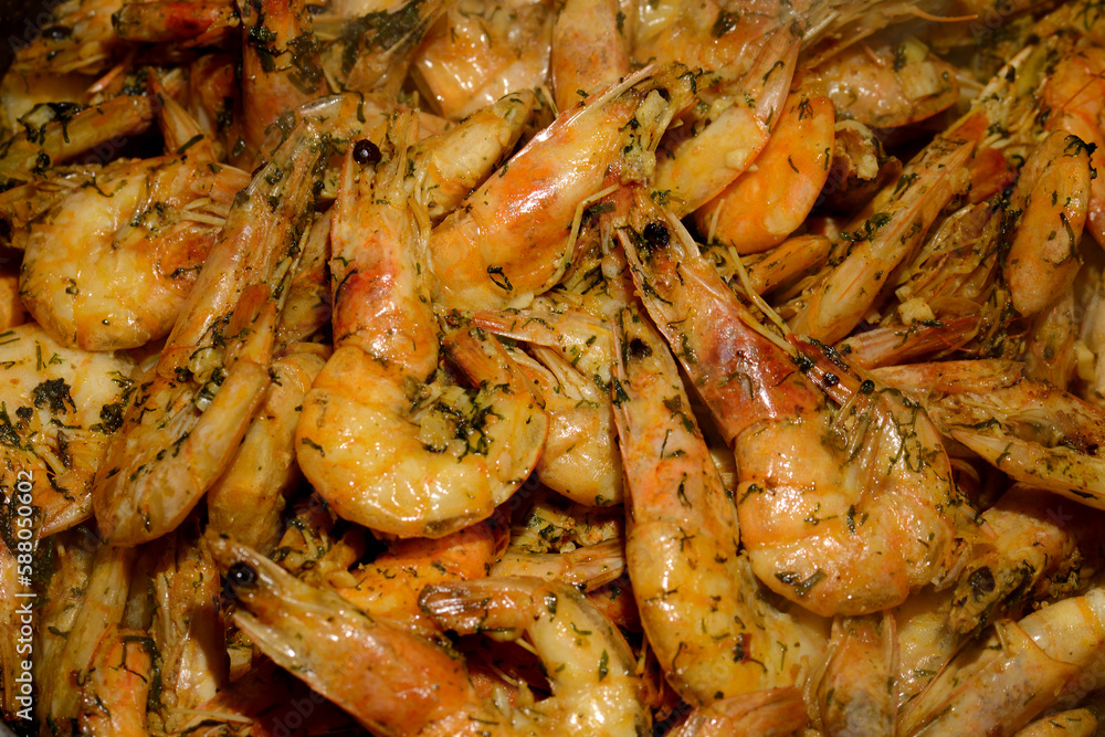 Delicious red fried unpeeled tiger prawns with the addition of oil, herbs, garlic and spices. Fried shrimp with dill and garlic. View from above. Close-up. Fragrant hot shrimp cooked in a frying pan Delicious red fried unpeeled tiger prawns with the addition of oil, herbs, garlic and spices. Fried shrimp with dill and garlic. View from above. Close-up. Fragrant hot shrimp cooked in a frying pan