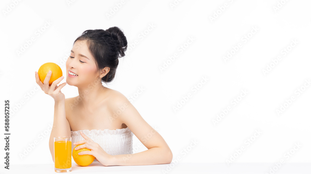 Diet girl Beautiful young lady hold fruit or orange look at orange fruit Pretty woman get good health and healthy skin She love drinking orange juice and eating fruit Health Care and Beauty concept Diet girl Beautiful young lady hold fruit or orange look at orange fruit Pretty woman get good health and healthy skin She love drinking orange juice and eating fruit Health Care and Beauty concept
