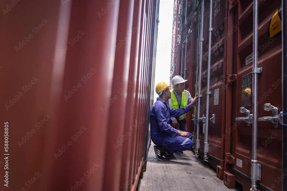 Engineer manager and foreman control or check inventory details of containers box, worker checking quantity of product in containers.