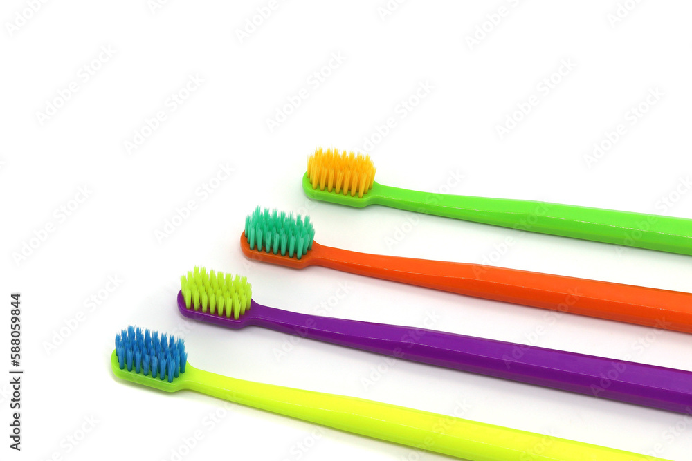 Multicolored toothbrushes isolated on white background Multicolored toothbrushes isolated on white background