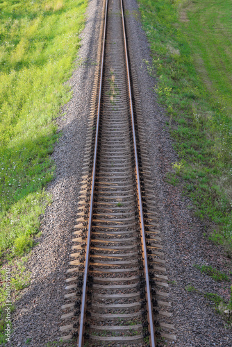 Railway track for the train. Rails view from above, going into the distance