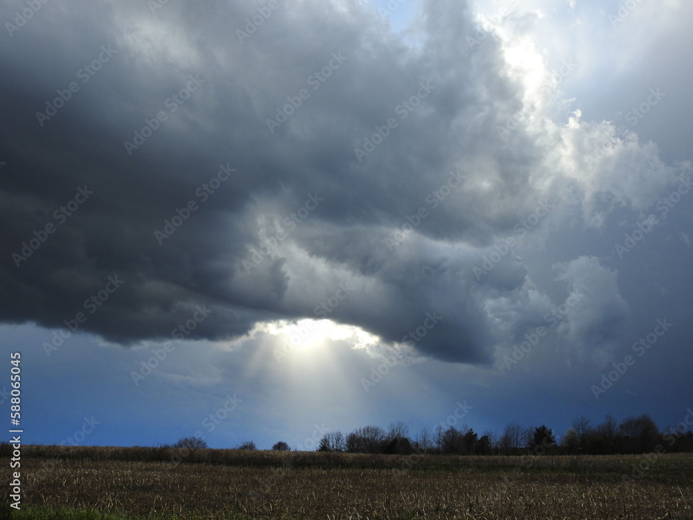 Storm clouds with rays of sunshine beaming down upon a field in Cecil County, Maryland. Storm clouds with rays of sunshine beaming down upon a field in Cecil County, Maryland.