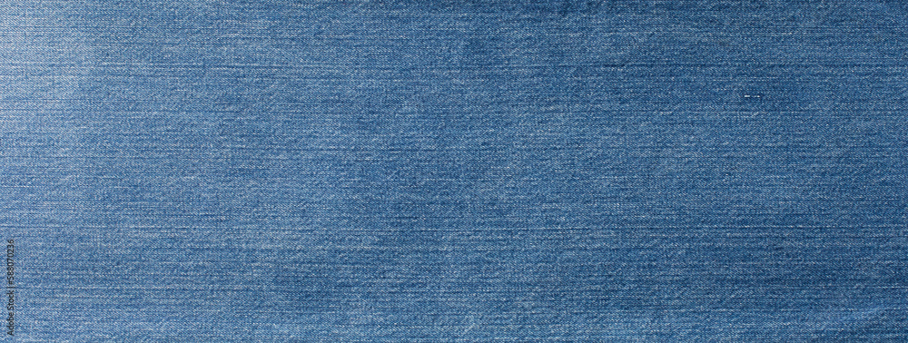 Blue denim jeans texture banner with copy space for text design background. Canvas denim fashion texture. Panoramic fashion banner Blue denim jeans texture banner with copy space for text design background. Canvas denim fashion texture. Panoramic fashion banner