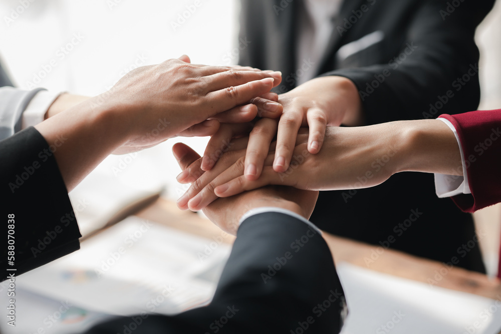 A group of business people joining hands, business meetings, startup company sales team meetings, brainstorming and summary of company performance. Business strategy management concept. A group of business people joining hands, business meetings, startup company sales team meetings, brainstorming and summary of company performance. Business strategy management concept.
