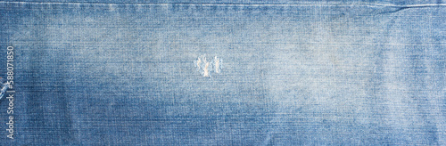 torn denim fashion jeans design texture. Blue denim jeans texture banner with copy space for text design background. Canvas denim fashion texture. Panoramic fashion banner
