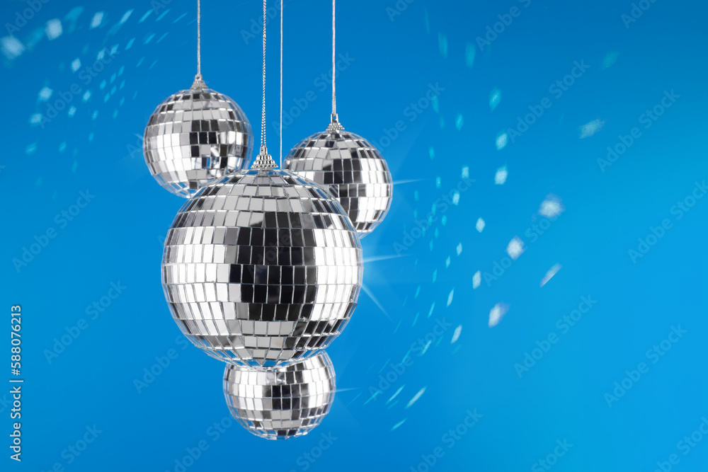 Fototapeta premium Bright shiny mirror disco balls reflecting light. Holidays concept.