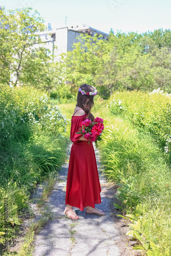 "The spring park and the girl with peonies