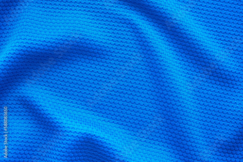 Blue football jersey clothing fabric texture sports wear background, close up top view