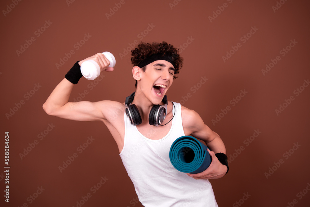 Retro style. A young attractive guy is doing aerobics. Retro style. A young attractive guy is doing aerobics.