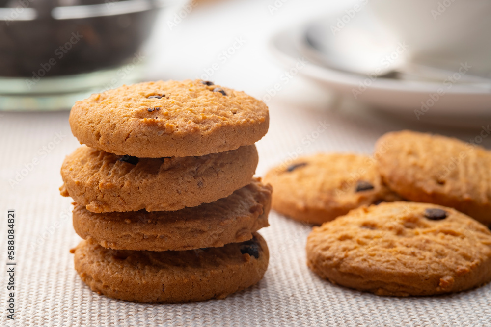 Heap of Chocolate chip cookies on wooden table Heap of Chocolate chip cookies on wooden table