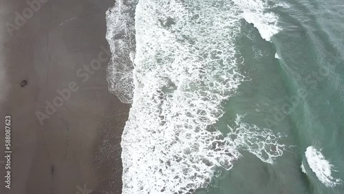 Aerial view of the Santolo beach Garut Indonesia, coast with foamy small waves. photo