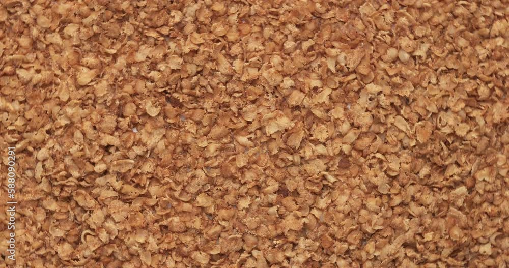 Closeup buckwheat flakes rotation, background, texture. Food background. Closeup buckwheat flakes rotation, background, texture. Food background.
