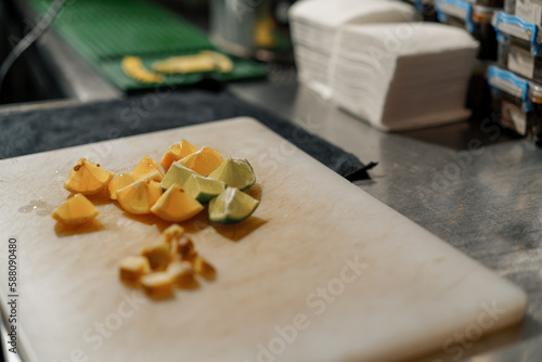 sliced fruits orange and lime lie on the table ingredients for making hookah kitchen concept