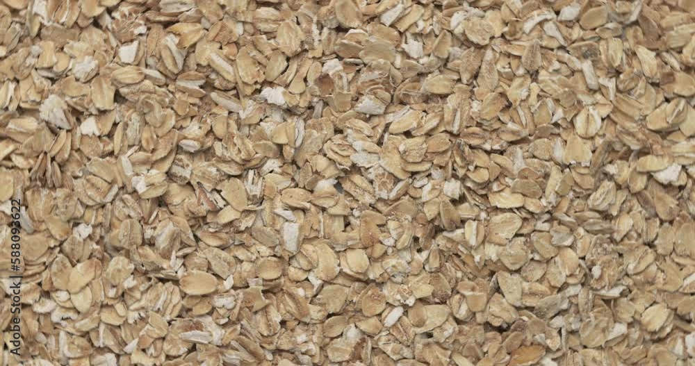 Closeup Oatmeal groats rotation, background, texture. Food background. Closeup Oatmeal groats rotation, background, texture. Food background.