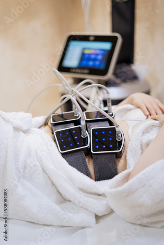 women lies in procedure cabinet for fat burning 