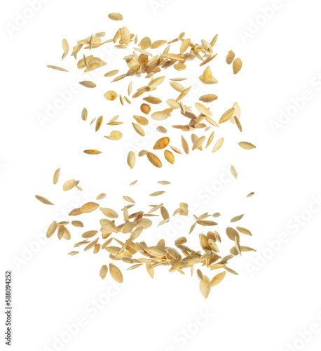 Falling Pumpkin seeds, isolated on white background, selective focus. Zero gravity food concept.