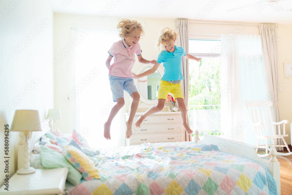 Child playing in bed. Kids room. Boy at home. Child playing in bed. Kids room. Boy at home.